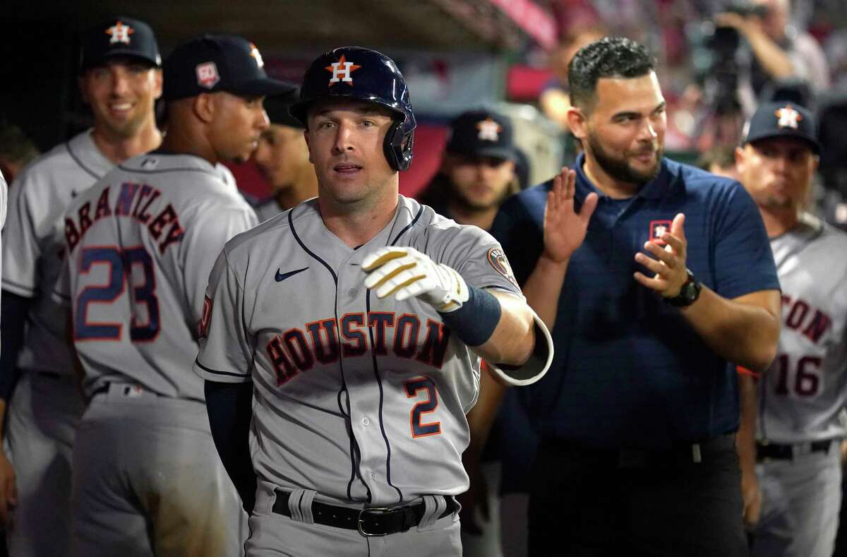 Houston Astros third baseman Alex Bregman (2) reacts after hitting a home run off of Los Angeles Angels Ryan Tepera during the eighth inning of opening day at Angel Stadium on Thursday, April 7, 2022 in Anaheim.