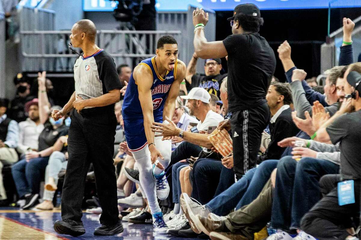 Golden State Warriors guard Jordan Poole reacts after making a three pointer during the fourth quarter of his NBA basketball game against the Los Angeles Lakers in San Francisco, Calif. Thursday, April 7, 2022. The Warriors defeated the Lakers 128-112.
