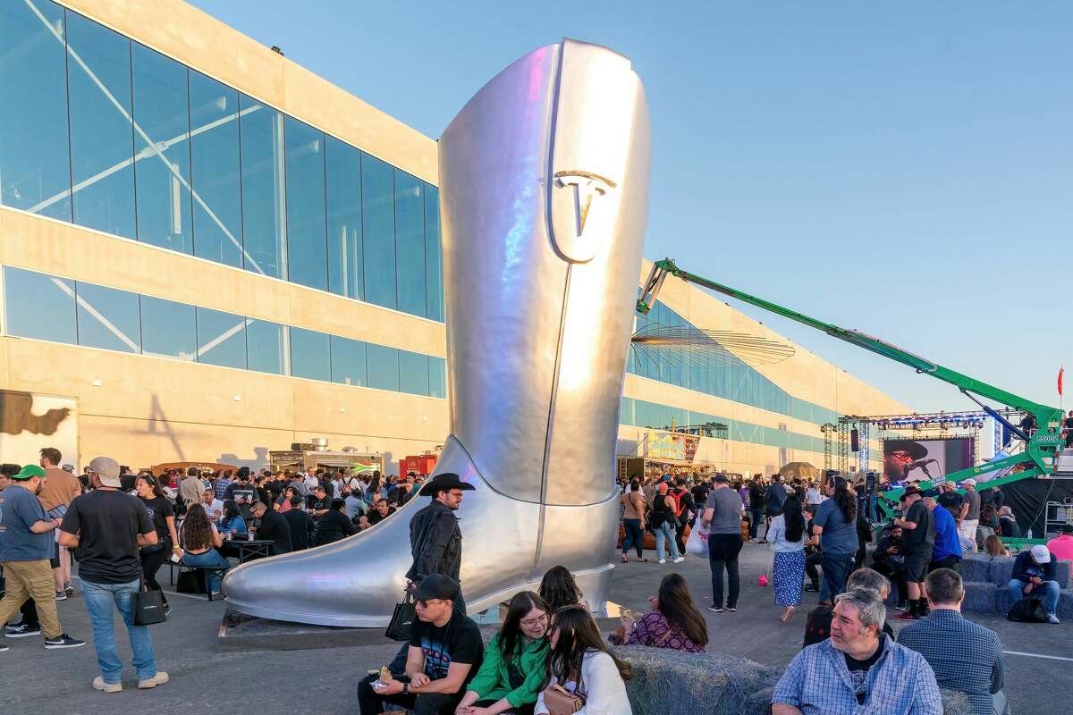 A giant cowboy boot is on display outside the Tesla Giga Texas manufacturing facility during the "Cyber Rodeo" grand opening party in April. It looks like Elon Musk has more in store for Texas. 