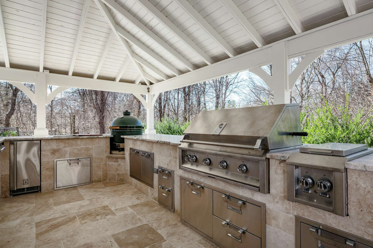The outdoor kitchen and bar outside the home on 11 English Drive in Wilton, Conn.