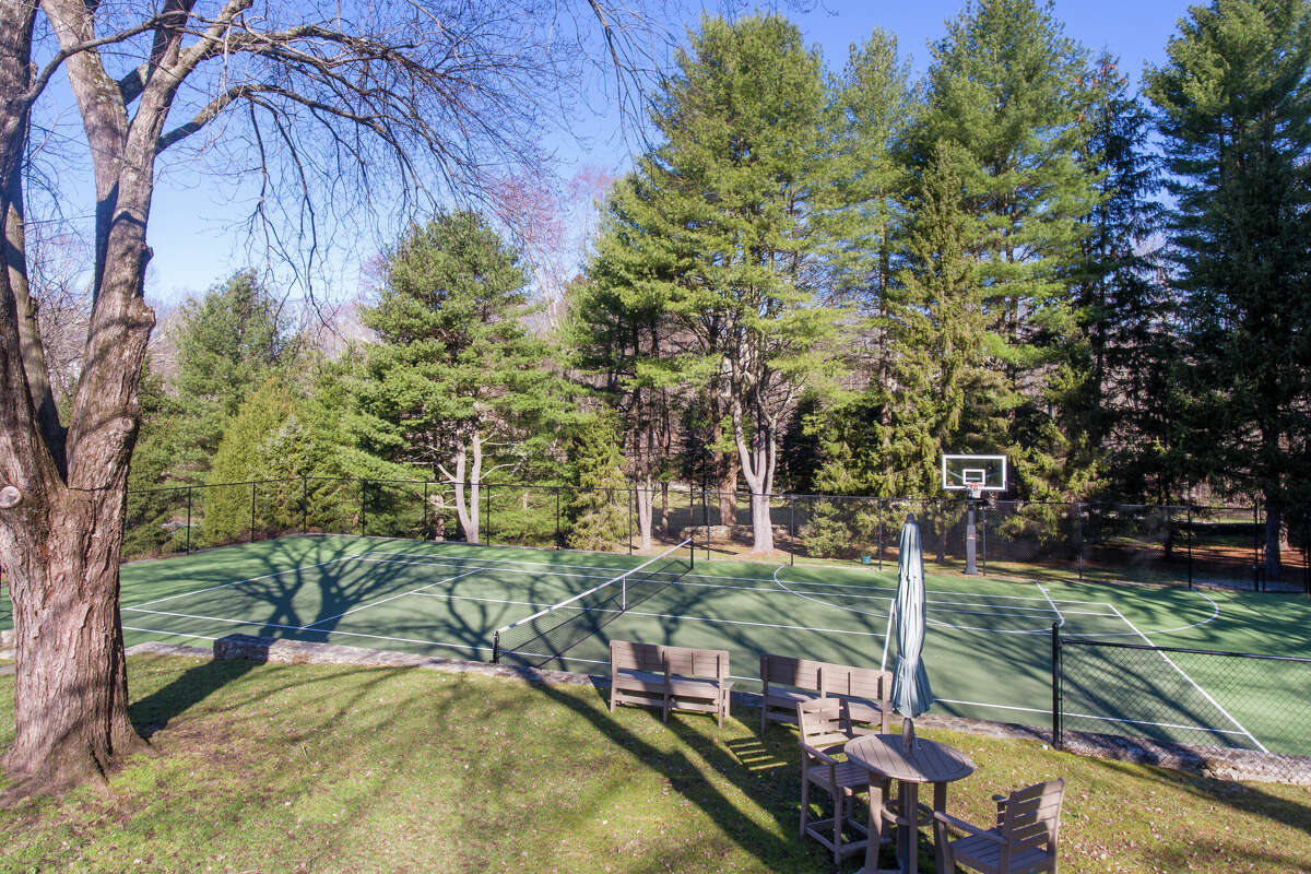 The joint basketball and tennis court at the home on 11 English Drive in Wilton, Conn.