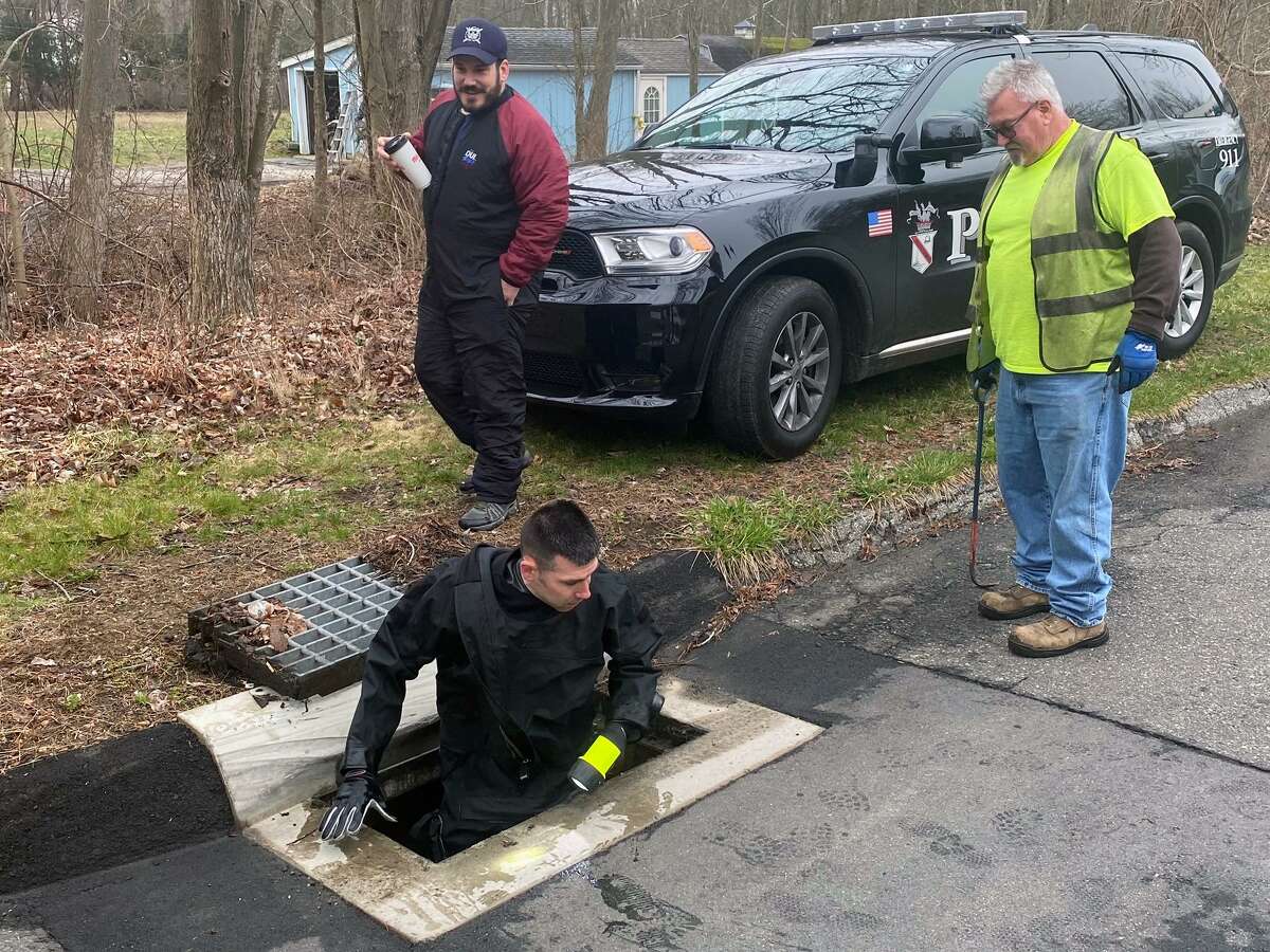 Danbury and State Police searched an area that included a small pond at the corner of Ball Pond Road and Pondcrest Road on Thursday morning. April 7, 2022, Danbury, Conn.