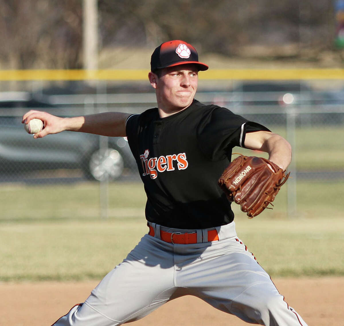 Greenfield's Brady Pembrook, shown pitching earlier this season at Roxana, worked a short shutout Thursday in the unbeaten Tigers' three-inning rout of North Greene in White Hall.