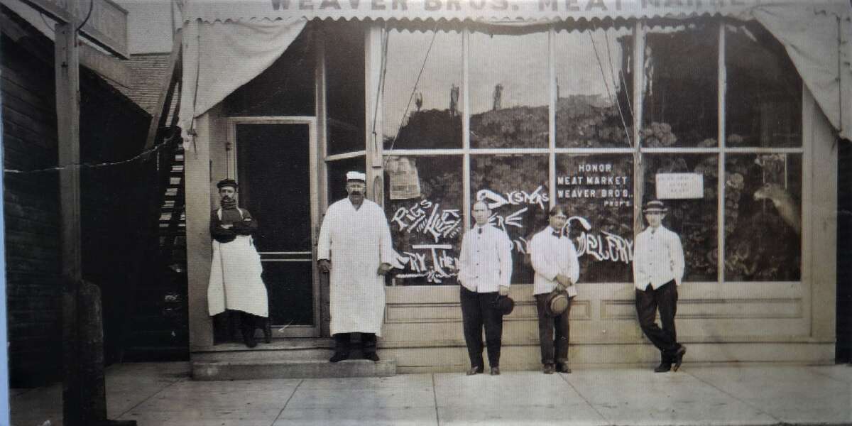 Weaver's Meat Market circa 1910, a long time institution in Honor, in the building where Jim's Joint barbecue is now. Butcher Orrin Weaver is second from left.