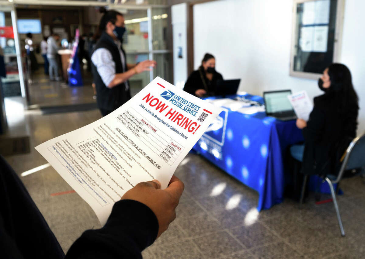 People fill out job applications at the U.S. post office in Garden Grove, CA on Tuesday, Jan. 4, 2022. (Photo by Paul Bersebach/MediaNews Group/Orange County Register via Getty Images)