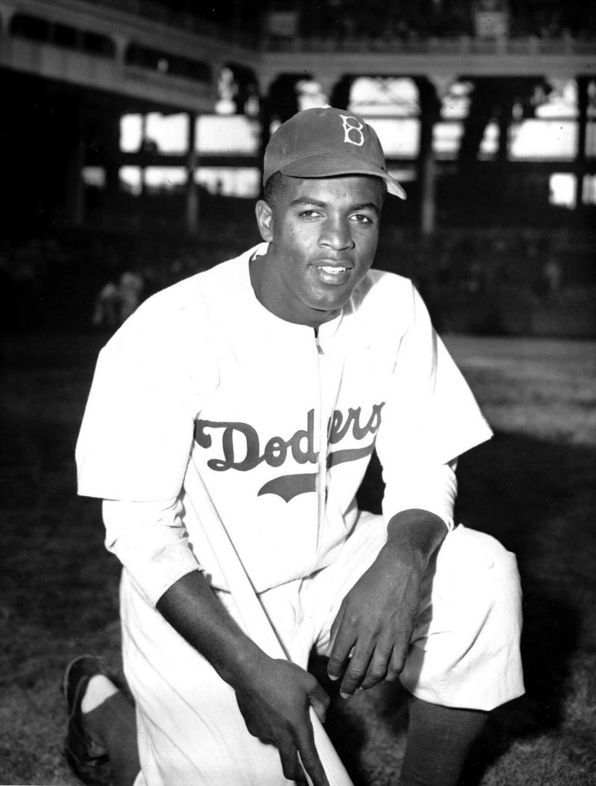 Jackie Robinson of the Brooklyn Dodgers poses at Ebbets Field in 1947. Robinson is the most consequential athlete in American history because no other athlete came close to having as big an impact beyond sports.
