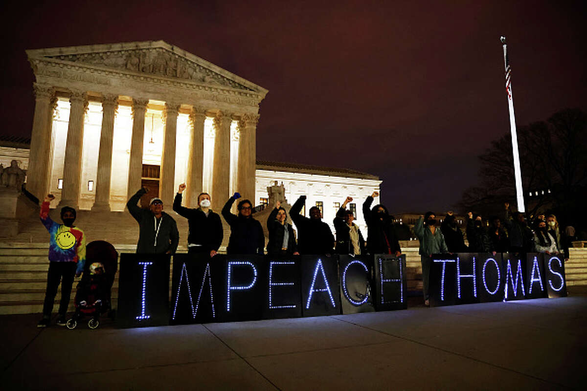 MoveOn activists call for the impeachment of Justice Clarence Thomas outside of the U.S. Supreme Court.