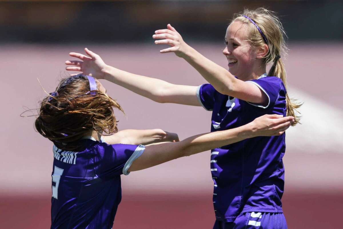 Ridge Point Panthers forward Hannah Warnken (3) celebrates forward Charlotte Richardson's (5) goal against the Atascocita Eagles in the first half of a Region III-6A semifinal girls playoff soccer game on April 8, 2022 at Abshire Stadium in Deer Park. 