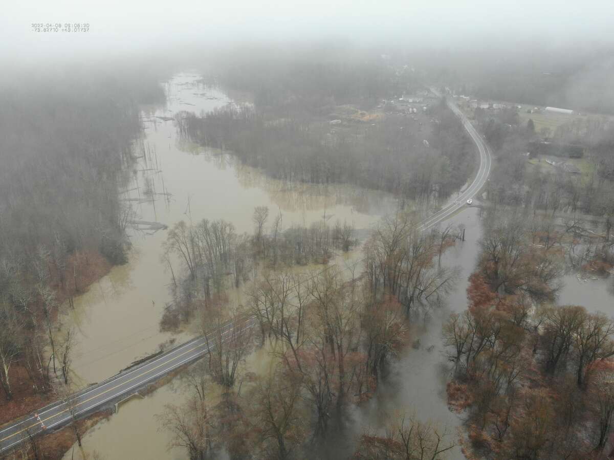 Downpour forces road closings, flood threats