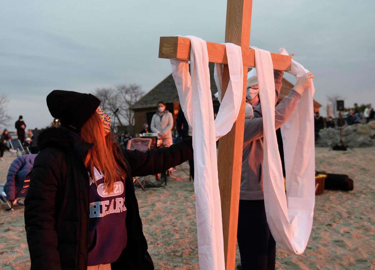 First Congregational Church of Greenwich holds its Easter sunrise service at Greenwich Point Park in 2021. The church will again hold a service at 6 a.m. Easter, April 17, at the beach. On April 15, Good Friday, it will hold a Community Cross Walk.