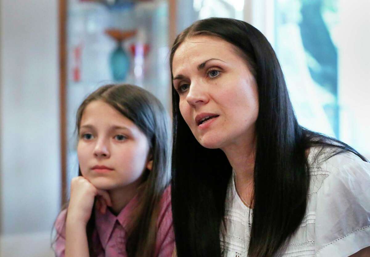 Kateryna Krezhenstouska and daughter is Alisa,12 years old, talk about their experiences fleeing from their home in the Ukraine Wednesday, April 6, 2022, in Houston. With the helps of their friend, Yana Kristal, they were able to make it out of the country and are staying with her in Houston.
