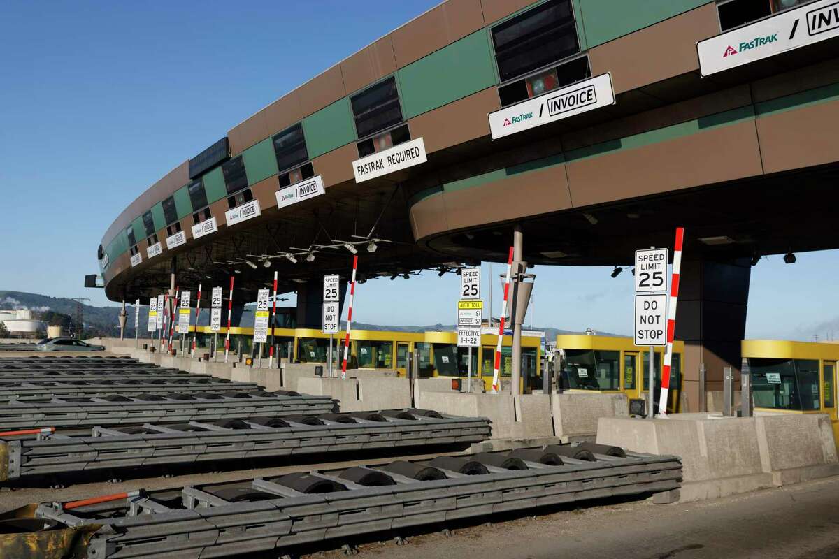Vehicles travel through the Benicia-Martinez Bridge Toll Plaza. When the coronavirus pandemic started, highway officials abruptly replaced in-person toll collection on the Bay Area’s seven state-owned bridges with electronic systems because of the danger of contagion. They have decided not to reinstate the human toll collectors. Tollbooths are the next thing to go.