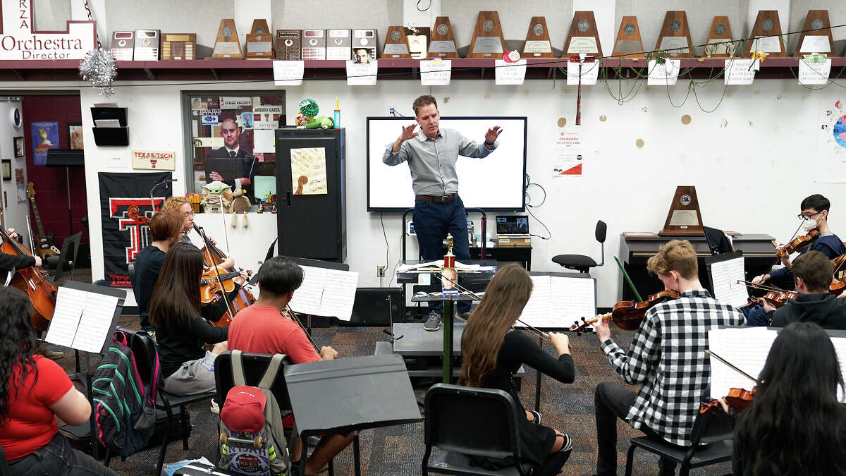 On Friday, Midland-Odessa Symphony & Chorale Music Director and Conductor Gary Lewis helped Legacy High School orchestra students tune-up before their spring concert.