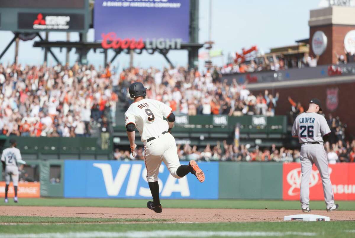 San Francisco Giants first baseman Brandon Belt (9) jogs around the bases after a home run in the eighth inning in an MLB game against the Miami Marlins, Friday, April 8, 2022, in San Francisco, Calif.
