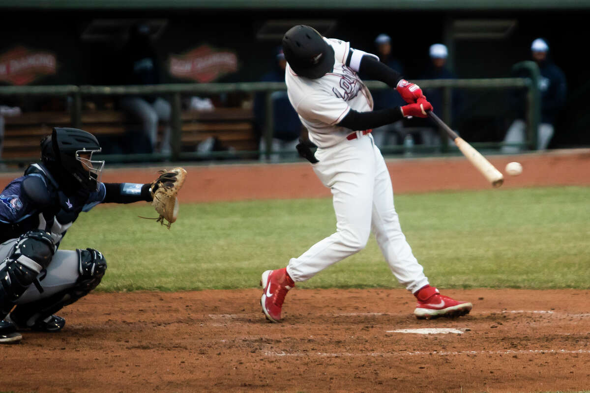 Great Lakes Loons outfielder Joe Vranesh swings on a pitch during the Loons' season opener against the West Michigan Whitecaps Friday, April 8, 2022 at Dow Diamond.
