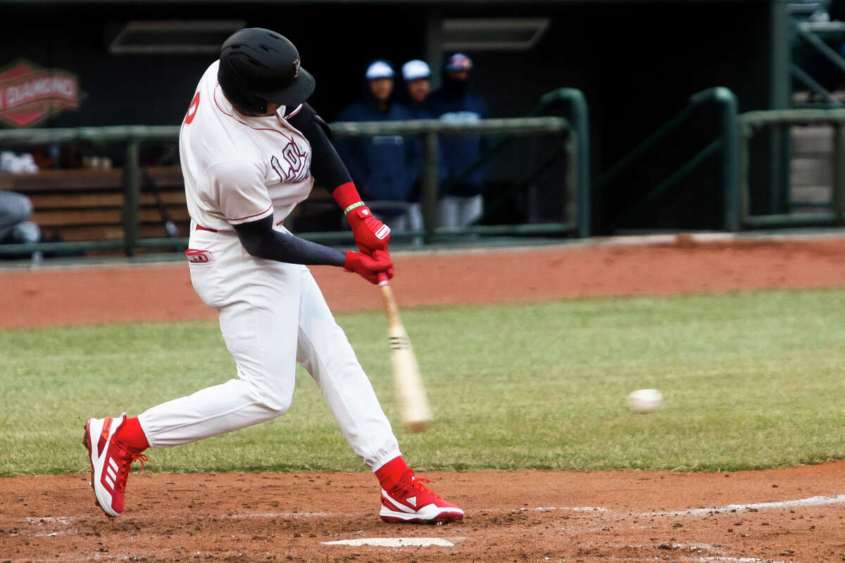 Great Lakes Loons infielder Leonel Valera swings on a pitch during the Loons' season opener against the West Michigan Whitecaps Friday, April 8, 2022 at Dow Diamond.