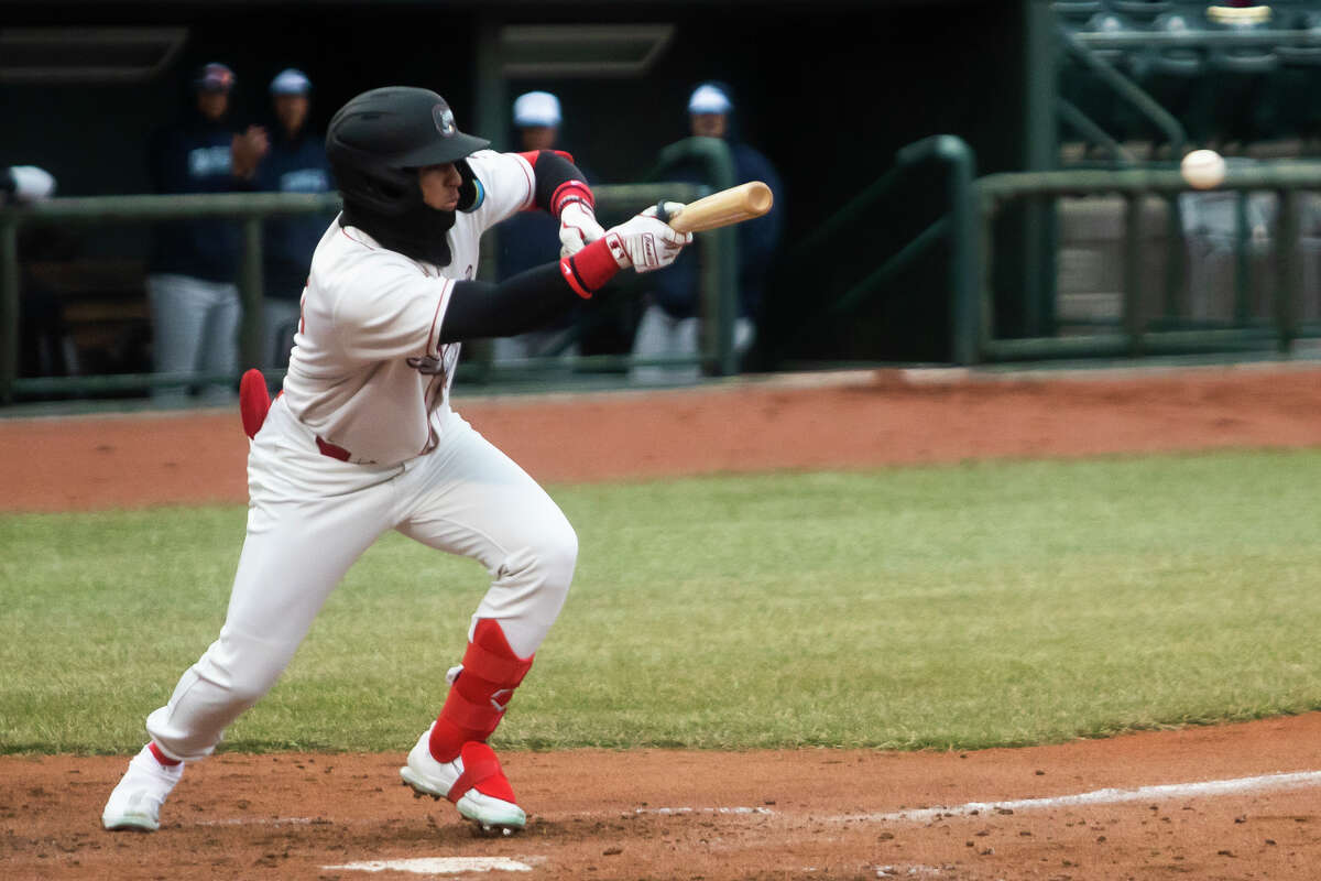 Great Lakes Loons outfielder Ismael Alcantara swings at a pitch during the Loons' season opener against the West Michigan Whitecaps Friday, April 8, 2022 at Dow Diamond.