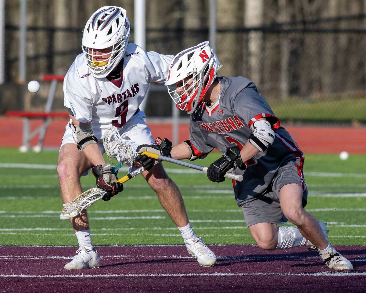 Burnt Hills midfielder Rocco Mareno and Niskayuna midfielder Cole Nappi scramble for a loose ball during a Suburban Council matchup at Burnt Hills Ballston Lake High School on Friday, April 8, 2022. (Jim Franco/Special to the Times Union)