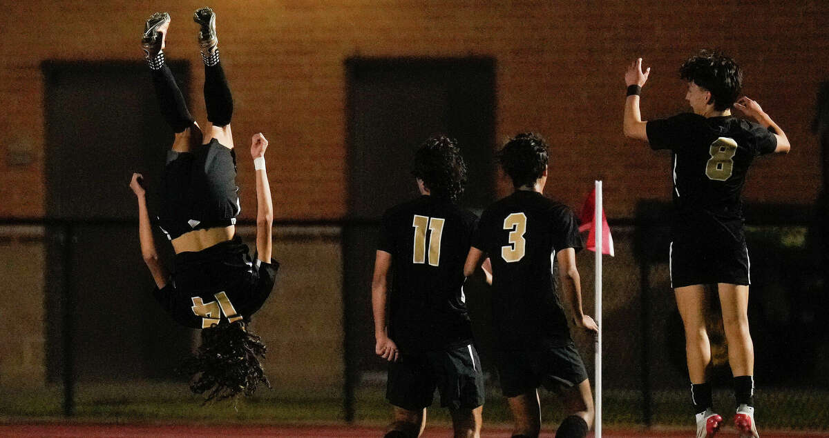 Jordan's Noah Betencourt, left, does a flip after scoring a goal during the second half of a Region III-5A semifinal high school soccer game against Foster, Friday, April 8, 2022, in Humble, TX.