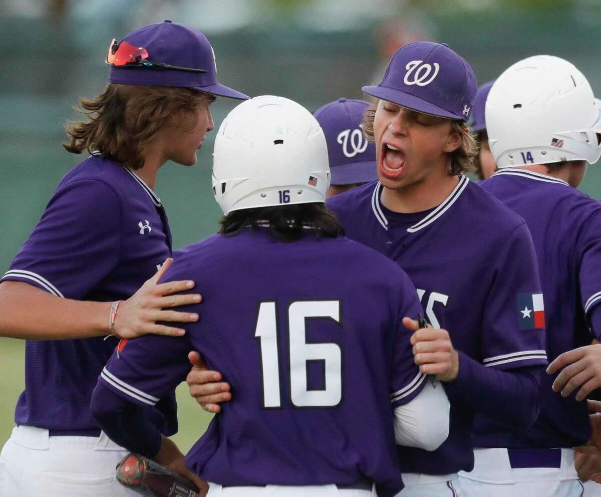 Willis’ Nick Millunzi, right, reacts after Jade Macaluso scored on Logan Wilson’s two-run single in the second inning of a District 13-6A high school baseball game at College Park High School, Friday, April 8, 2022, in The Woodlands.