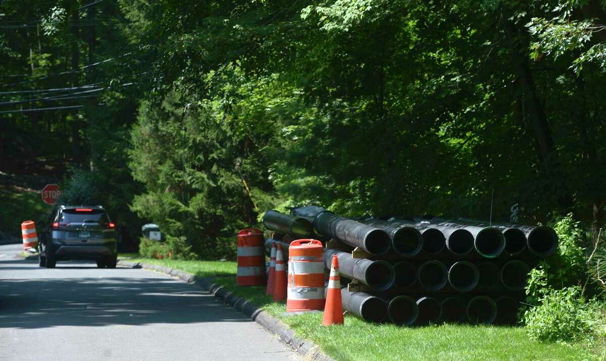 Pipes for a water main replacement, by a contractor for Aquarion Water Company, are shown on Eleven Levels Road, Ridgefield, in 2021. Aquarion Water Company is conducting a water main cleaning project in the company’s Litchfield system between April 11 and May 12.