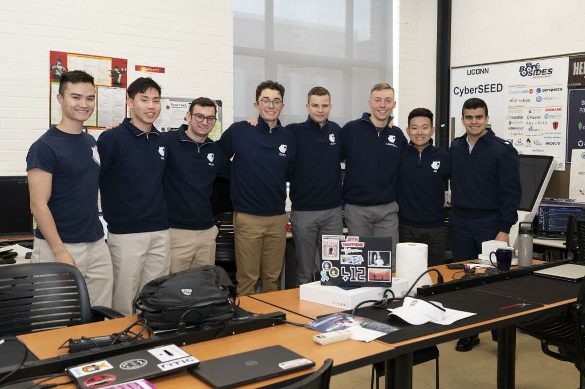 U.S. Coast Guard Academy cadets, members of the Academy's cyber team, pose for a group photo while participating in the National Security Agency's annual cyber exercise on Apr. 1, 2022.