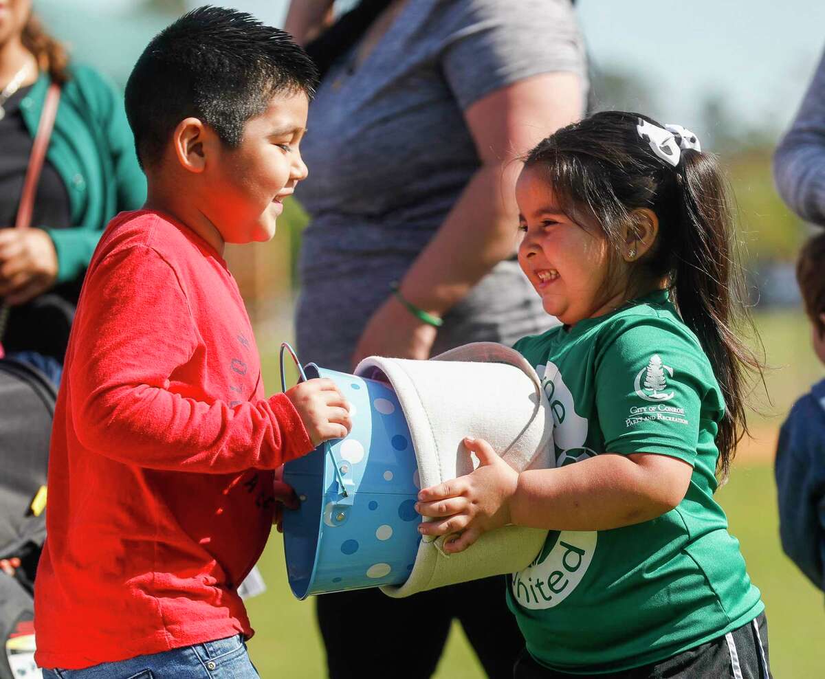 Natalie Garza, right, plays with Benjamin Gomez before the annual Mr. Bunny Easter Egg Hunt at Carl Barton Jr. Park, Saturday, April 9, 2022, in Conroe.