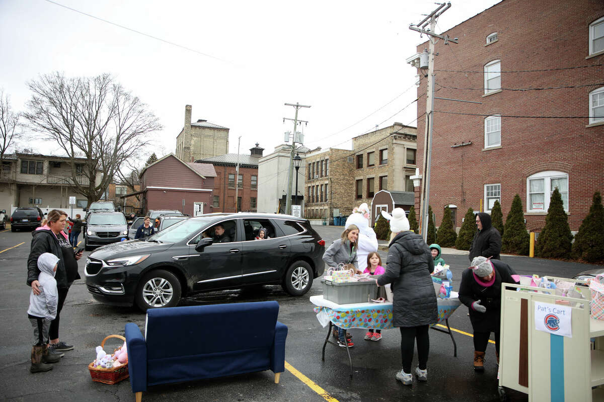 Lines of cars wrap around the parking lot of the Manistee County Library for celebration of spring with the Easter Bunny from noon to 1:30 p,m. on Saturday. Despite cold weather and a snow shower around 175 people showed up, library staff said.  