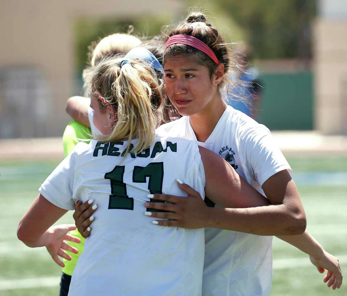 Reagan Brooke Castillo (15) is consoled by teammate Reagan Emma O’Brien (17). Austin Westlake defeated Reagan 3-0 at Region IV-6A Region IV-6A girls soccer final on Friday, Saturday, April 9, 2022 at Comalander Stadium