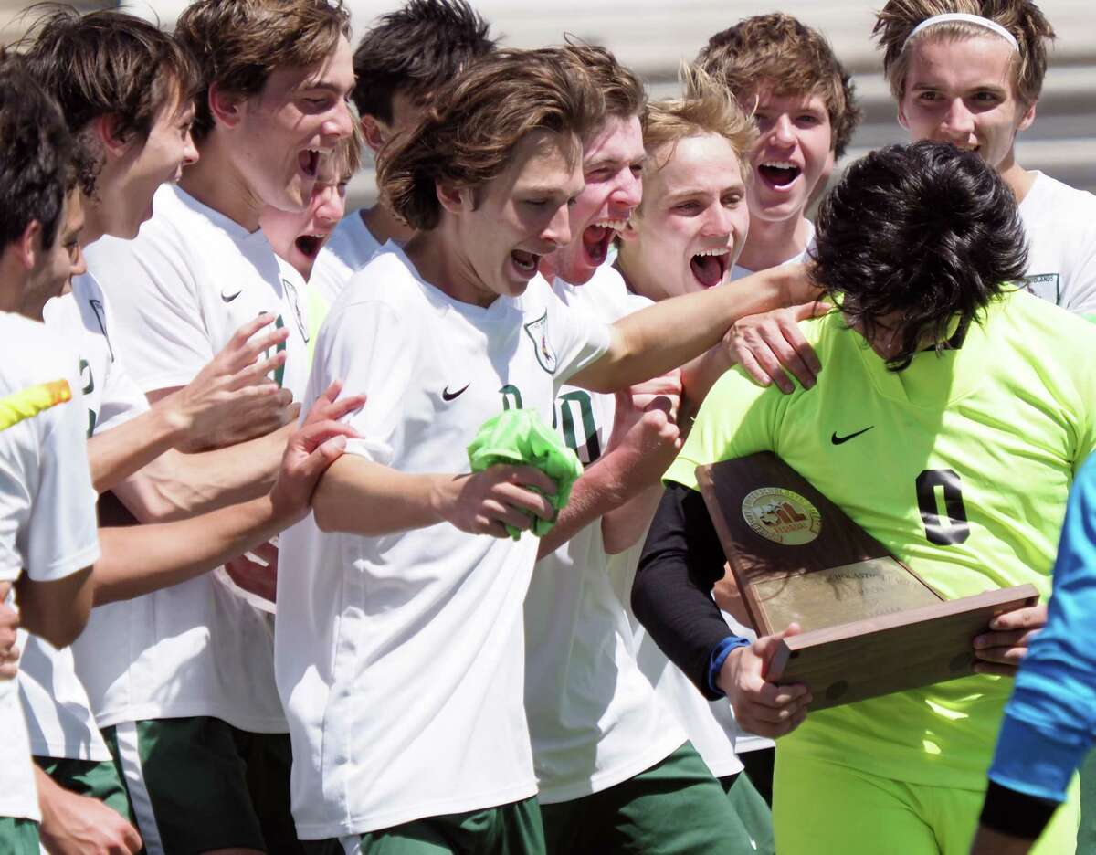 The Woodlands High School Highlanders celebrate after defeating the MacArthur Generals in the 2022 UIL Region II-6A regional soccer championship at the Kelly Reeves Athletics Complex on April 9, 2022 in Austin.
