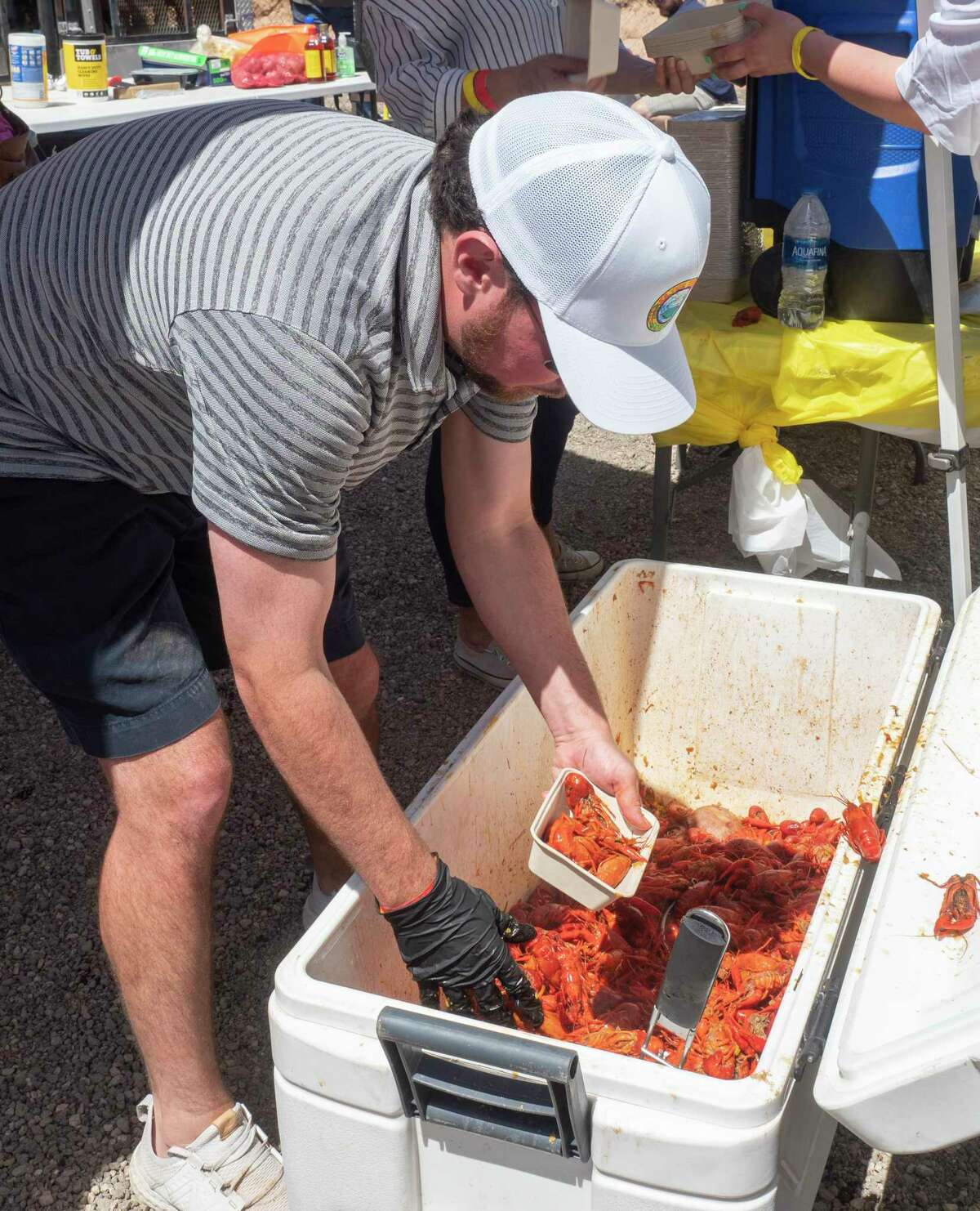 File photo: Zachary Duron serves up fresh boiled crawfish with Kajun Thunda as they serve thousands of crawfish lovers came out for the 1st Crawfish Cook-off 04/09/2020 at The Tailgate. Tim Fischer/Reporter-Telegram