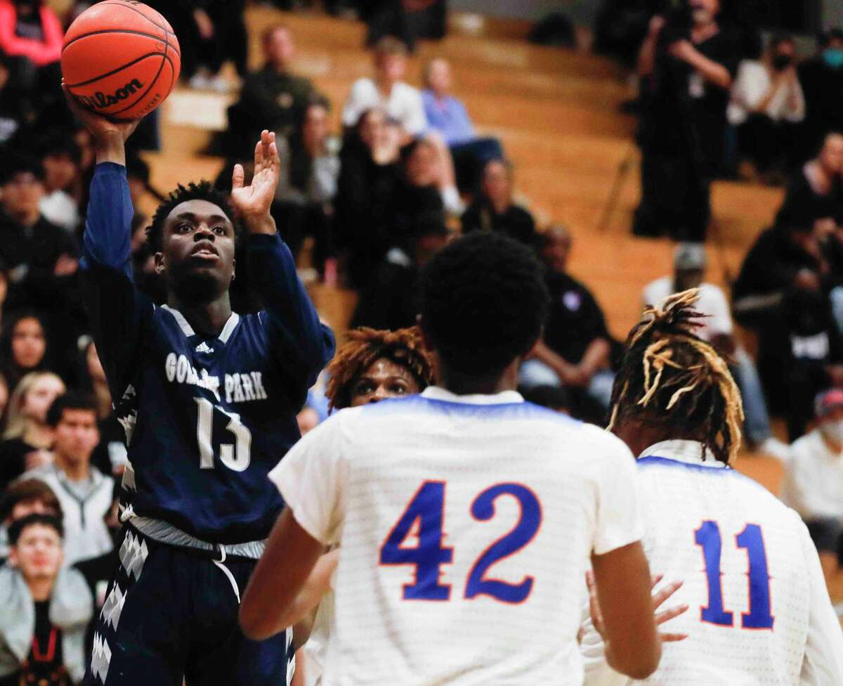 College Park small forward Ellis Ibizugbe (13) shoots during the first quarter of a high school basketball game at Grand Oaks High School, Tuesday, Jan. 11, 2022, in Spring.