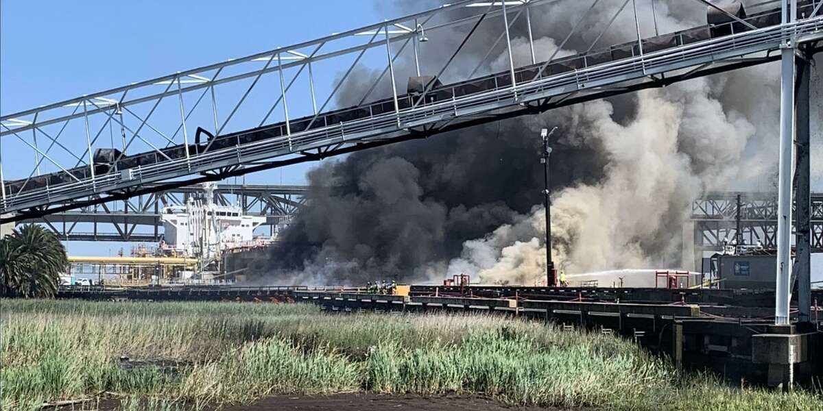 Firefighters were battling a fire near the Amports docks in Benicia, Calif. on Saturday afternoon.