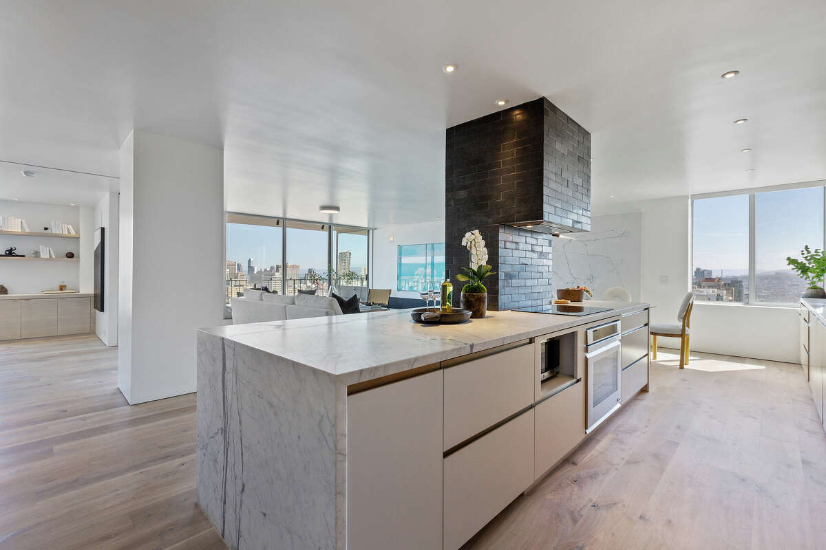 The penthouse features an open plan and high-end, modern finishes.