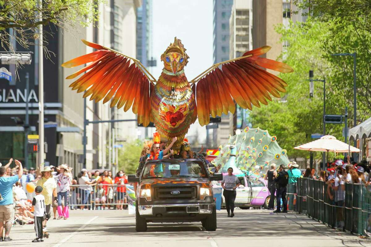 Rising Strong, an art car created by the Waters family of Bellaire, drives down Walker Street during the 35th Annual Houston Art Car Parade on Saturday, April 9, 2022, in downtown Houston.