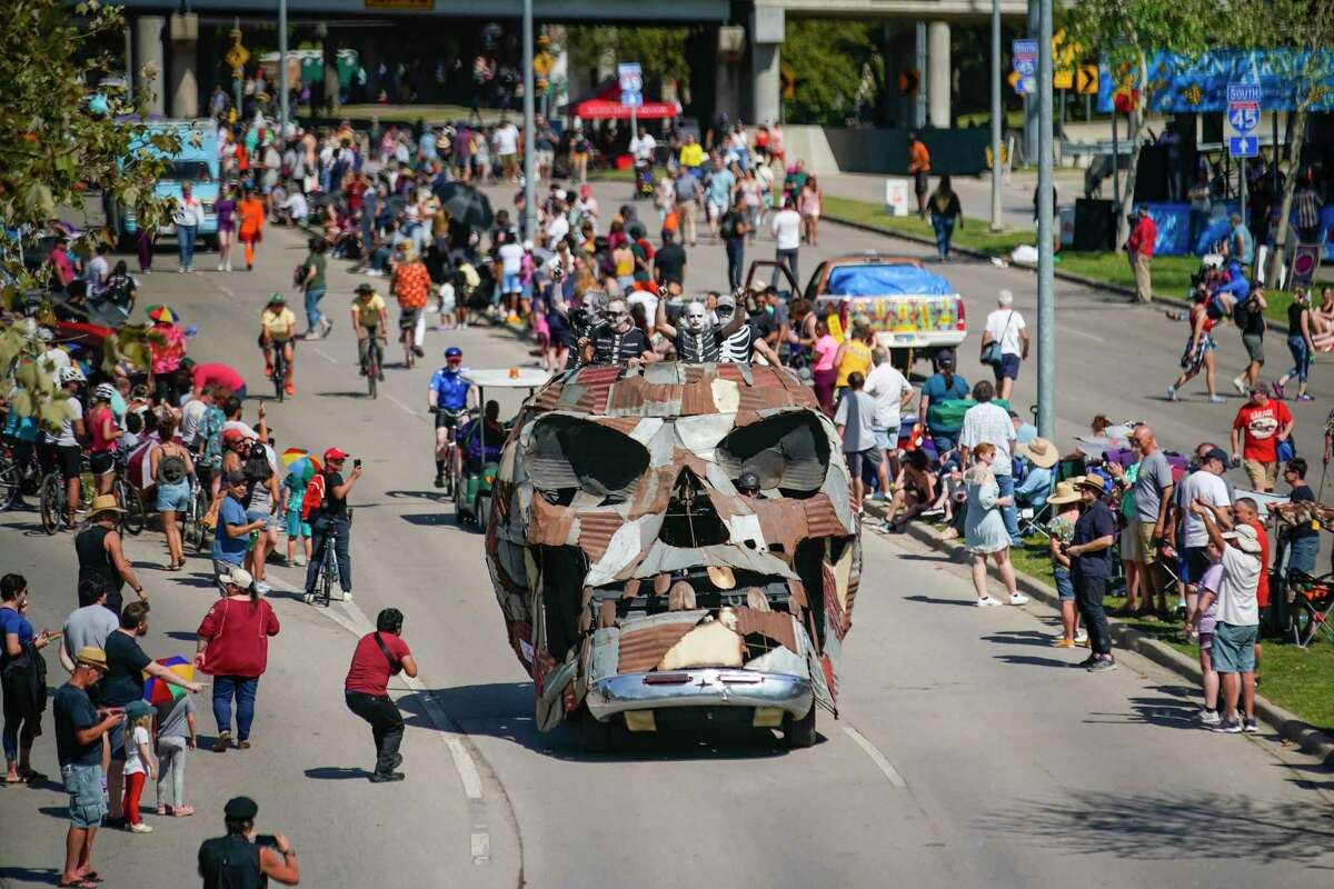 Metacarskull, created by the Texas Wheelbarrow Association, travels down Allen Parkway during the 35th Annual Houston Art Car Parade on Saturday, April 9, 2022, in downtown Houston.