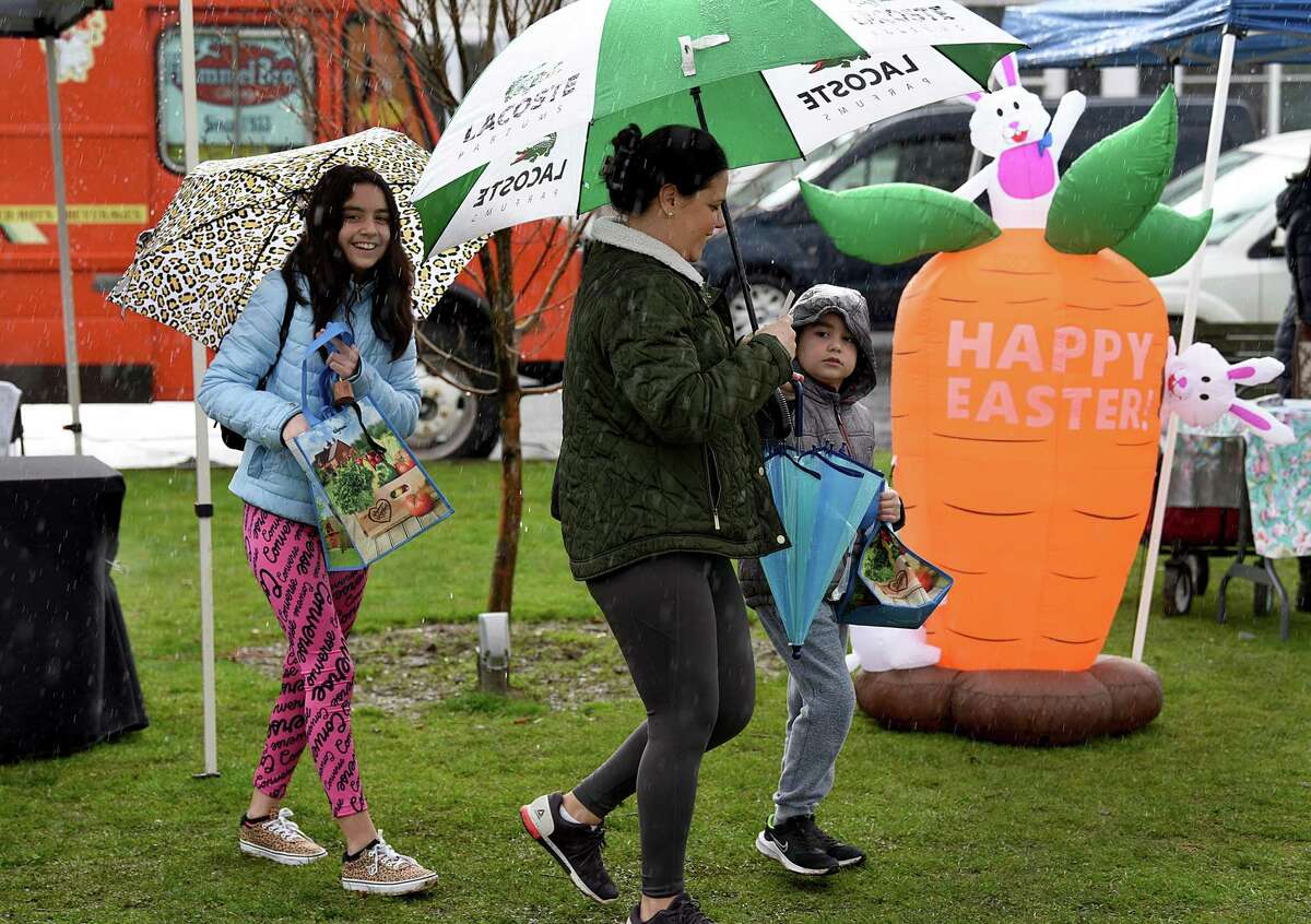 The Downtown Milford Business Alliance hosts an Easter event on the downtown Green on a very rainy and sometimes windy Saturday, April 9, 2022.