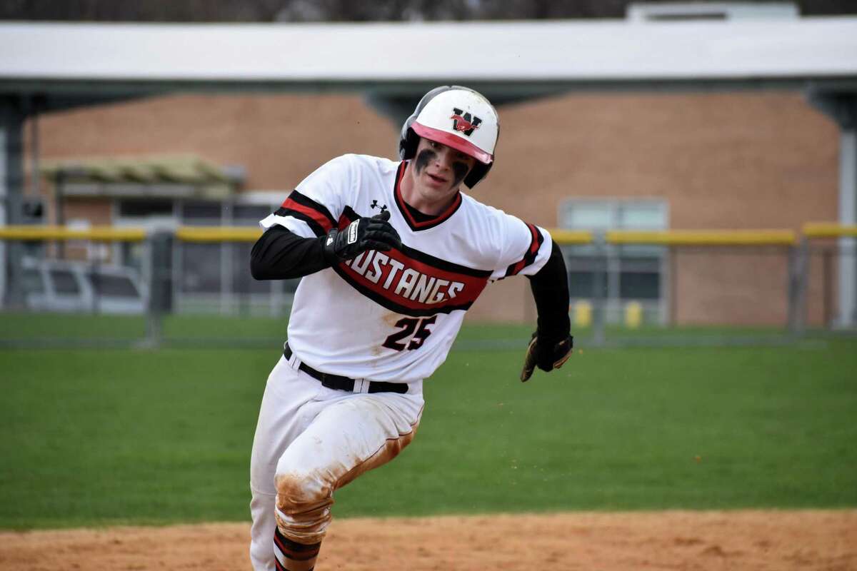 Fairfield Warde’s Will Eustace rounds third base during a baseball game against Coginchaug at Fairfield Warde, Fairfield on Saturday, April 9, 2022.