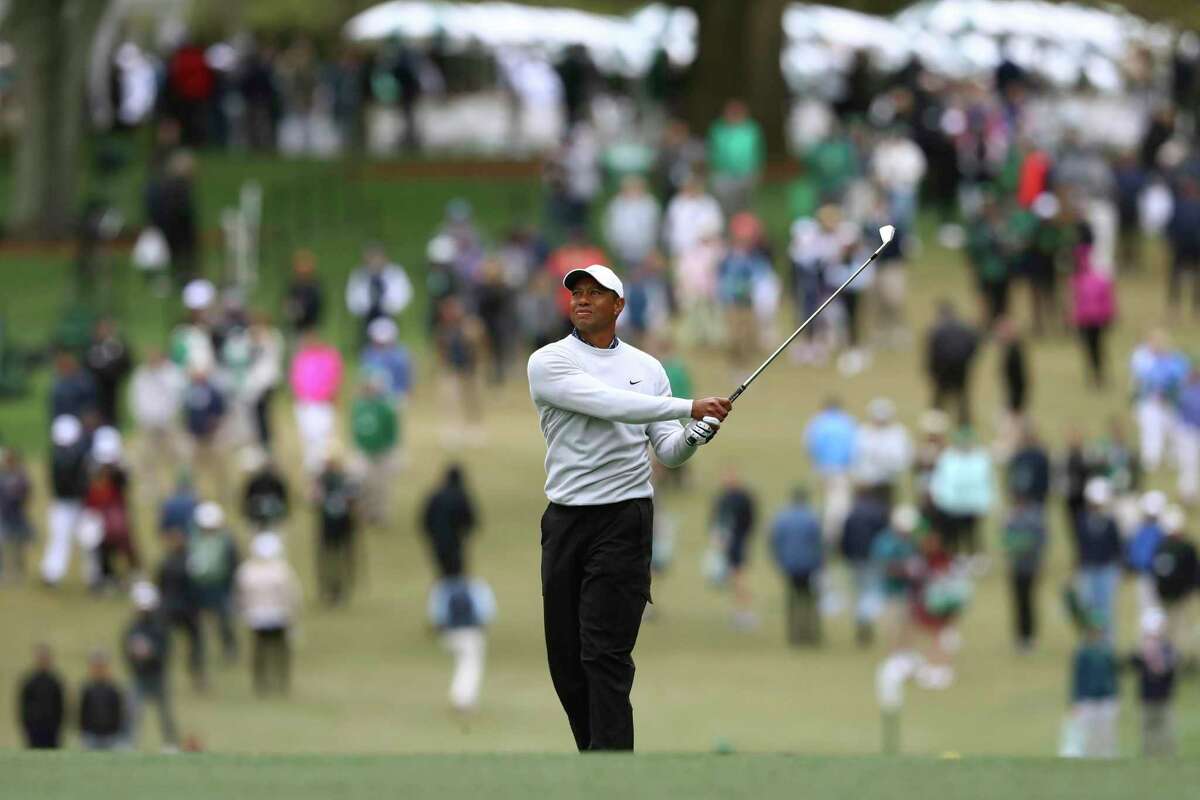 Tiger Woods watches his second shot on the first hole during the third round of the Masters golf tournament at Augusta National on Saturday, April 9, 2022, in Augusta, Ga. (Curtis Compton/Atlanta Journal-Constitution via AP)