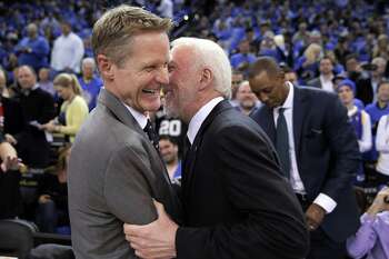 Warriors head coach Steve Kerr shares a moment with Gregg Popovich before the first half of the Golden State Warriors game against the San Antonio Spurs at Oracle Arena in Oakland, Calif., on Monday, January 25, 2016.
