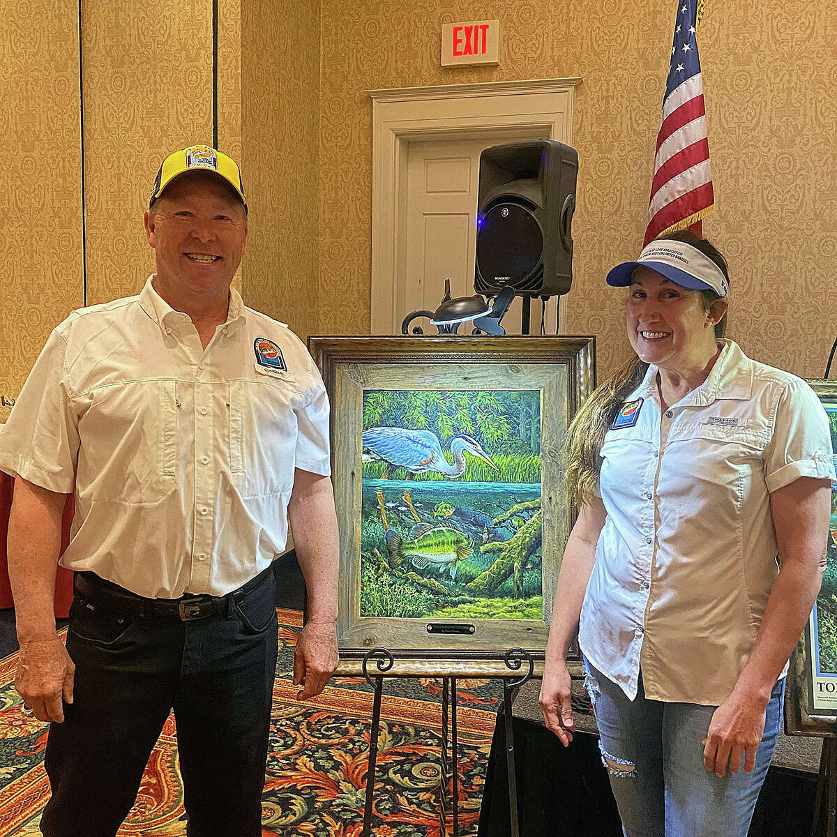 Bruce and Denise Rogers placed the highest bid on artist Eddie Pastureau’s original painting titled “Double Jeopardy on Toledo Bend.”