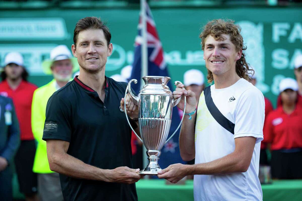 Max Purcell (Left) and Matthew Ebden (Right), of Australia, pose with the championship trophy at mid court after defeating Ivan and Matej Sabanov, of Serbia, in the doubles final of the Fayez Sarofim & Co. U.S. Men's Clay Court Championships at River Oaks Country Club, Saturday, Apr 9, 2022, in Houston.