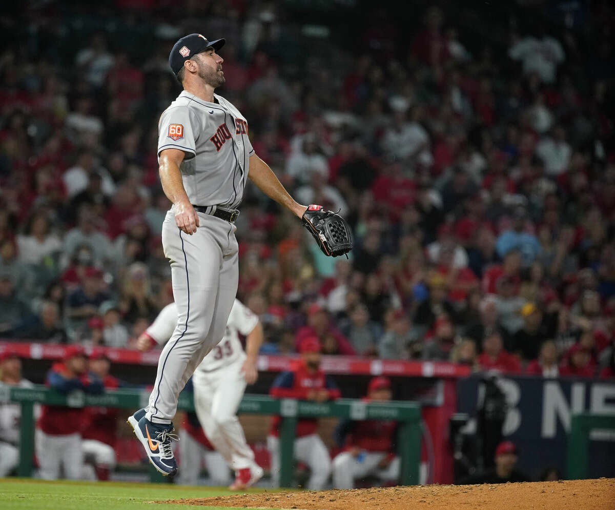 Houston Astros starting pitcher Justin Verlander (35) hops up as Los Angeles Angels Mike Trout lined out to center fielder Chas McCormick to end the fifth inning of an MLB baseball game at Angel Stadium on Saturday, April 9, 2022 in Anaheim.