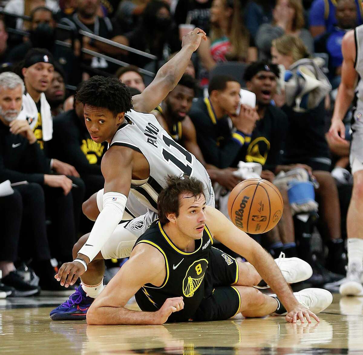 SAN ANTONIO, TX - APRIL 9: Nemanja Bjelica #8 of the Golden State Warriors steals the ball from Josh Primo #11 of the San Antonio Spurs in the second half at AT&T Center on April 9, 2022 in San Antonio, Texas. NOTE TO USER: User expressly acknowledges and agrees that, by downloading and or using this photograph, User is consenting to terms and conditions of the Getty Images License Agreement. (Photo by Ronald Cortes/Getty Images)