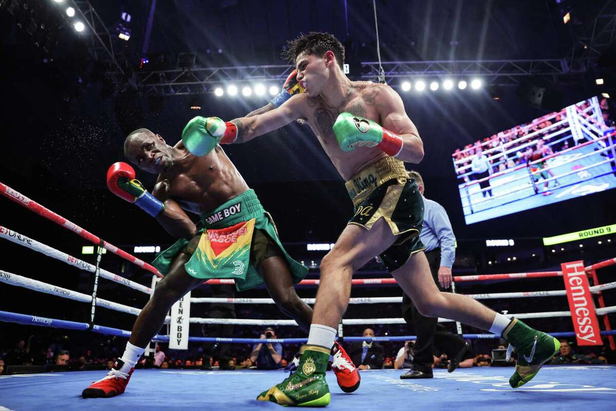Ryan Garcia and Emmanuel Tagoe exchange punches during their Lightweight bout at the Alamodome on April 9, 2022 in San Antonio.