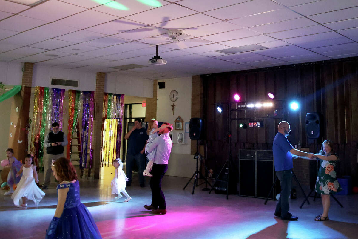Fathers and daughters took to the dance floor at Manistee Catholic Central School for the event, "dad daughter dancing" the Saturday.  There were at least 50 girls and their fathers at the event. 