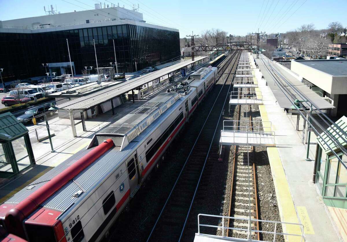 A Metro-North train passes through the Greenwich Train Station in Greenwich, Conn. Monday, Feb. 28, 2022.
