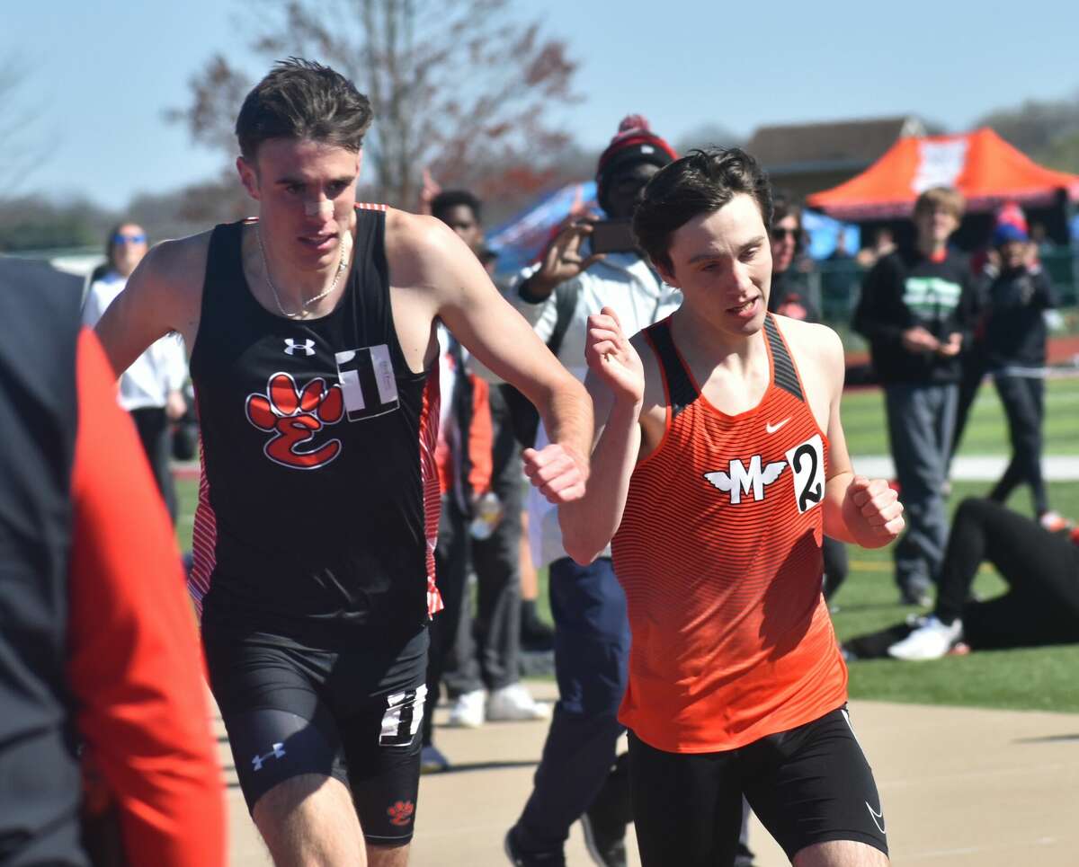 Edwardsville's Ryan Watts, left, edges out Minooka's Zachary Balzer during the Norm Armstrong Invitational at Belleville West on Saturday in Belleville.