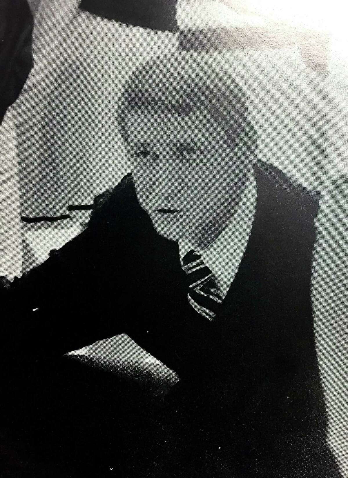 Texas Lutheran basketball coach Jim Shuler talks to his team during a timeout in a match in the late 1980s at the Memorial Gym in Seguin.