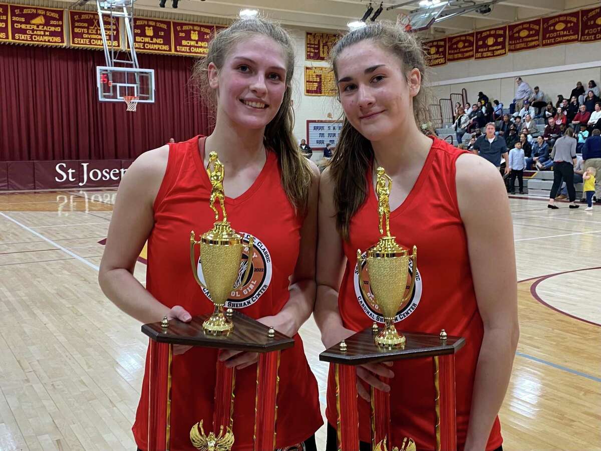 Seymour’s Kenzie Sirowich, left, and Sacred Heart Academy’s Rosa Rizzitelli after the JCC Schoolgirl Classic on Sunday in Trumbull. Sirowich won the MVP of the game and Rizzitelli earned the hustle award.